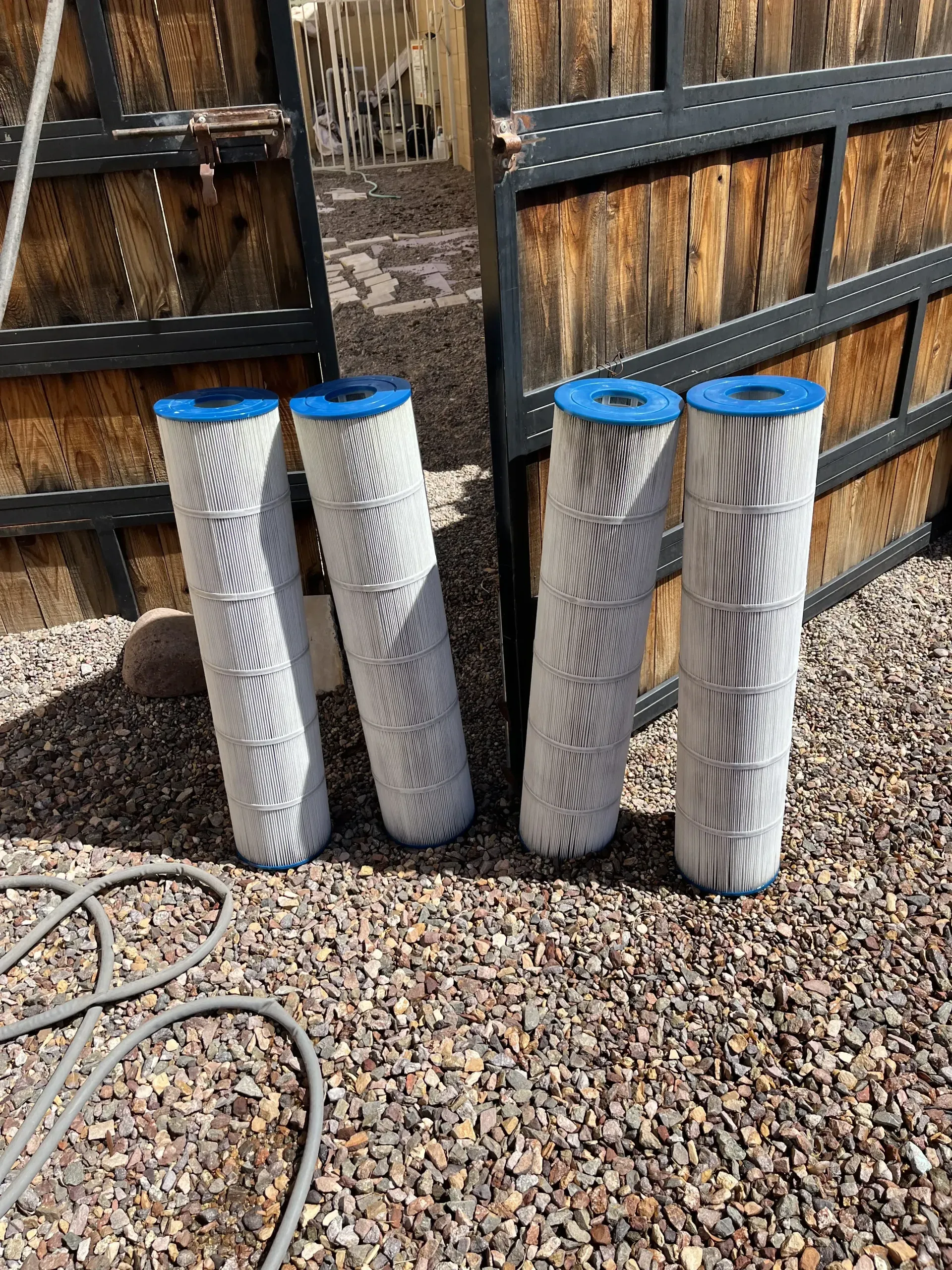 Four clean pool filter cartridges after service by AZ Veteran Pools in the Greater Phoenix Area